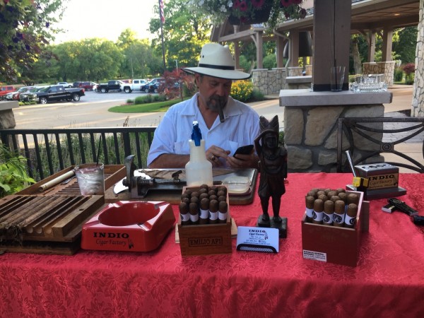Marvin Mirick making hand-rolled cigars at an event