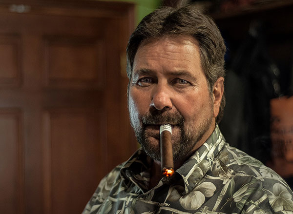 Owner, Marvin Mirick, smoking a cigar