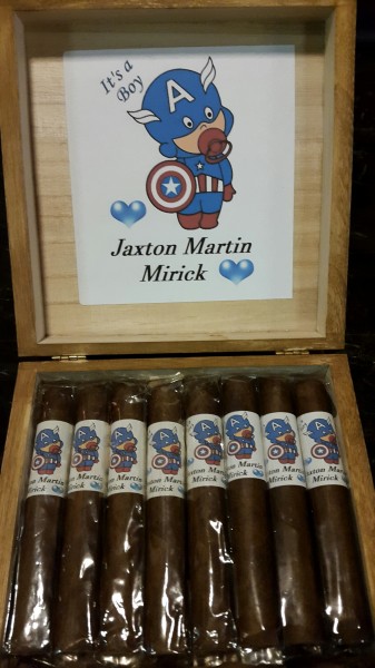 A box of cigars with custom labels for an event